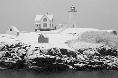 Maine's Nubble Lighthouse in snowstorm.